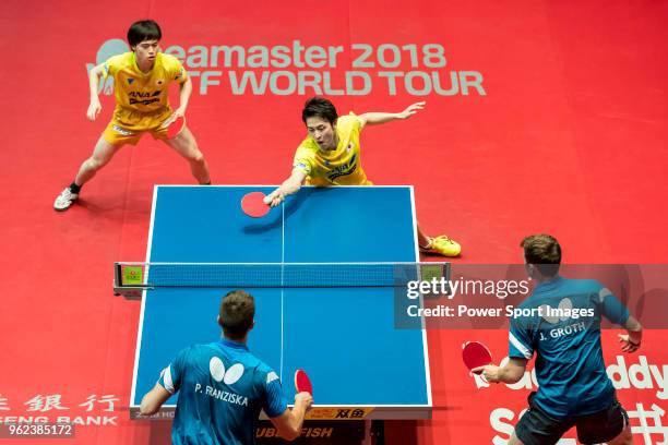 Masataka Morizono and Yuya Oshima of Japan compete against Patrick Franziska of Germany and Jonathan Groth of Denmark during men's doubles -...