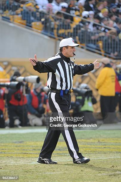 National Football League referee Pete Morelli signals during a game between the Baltimore Ravens and the Pittsburgh Steelers at Heinz Field on...