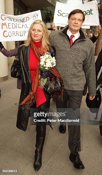 Dr Andrew Wakefield walks with his wife Carmel after speaking to reporters at the General Medical Council on January 28, 2010 in London, England. Dr...