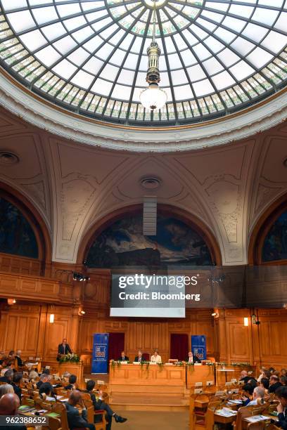 Benoit Coeure, executive board member of the European Central Bank , left, delivers a speech as Mark Carney, governor of the Bank of England , second...