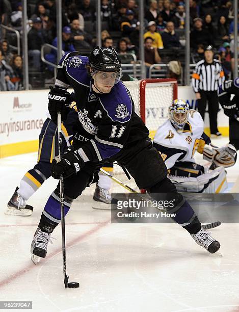 Anze Kopitar of the Los Angeles Kings looks to make a play in front of Ryan Miller of the Buffalo Sabres during game at the Staples Center on January...