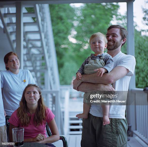 family on porch - four people foto e immagini stock