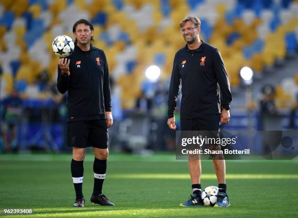 Jurgen Klopp, Manager of Liverpool and Peter Krawietz assistant coach of Liverpool look on during a Liverpool training session ahead of the UEFA...