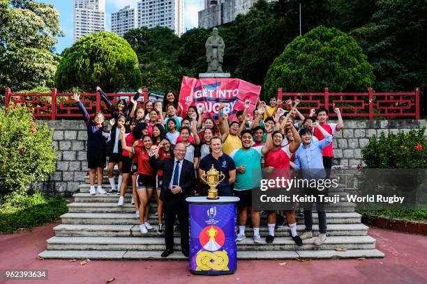 England's Rugby World Cup 2003 winner Josh Lewsey and the students from Confucius Hall Secondary School pose for a group photo during the Rugby World...