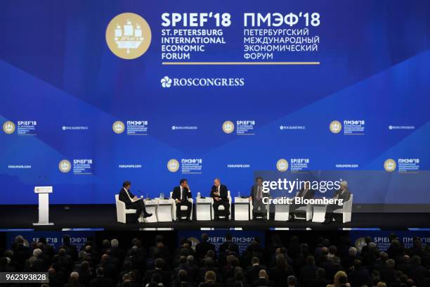 From left to right, John Micklethwait, editor-in-chief at Bloomberg News, Emmanuel Macron, France's president, Vladimir Putin, Russia's president,...