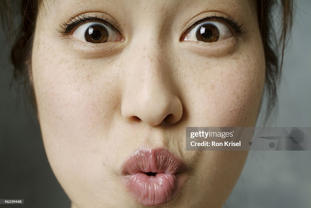 Woman puckering her lips