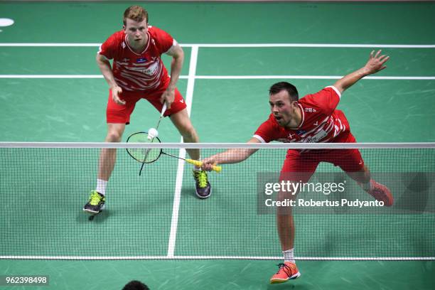 Kim Astrup and Anders Skaarup Rasmussen of Denmark compete against Takuto Inoue and Yuki Kaneko of Japan during the Semi-finals match on day six of...