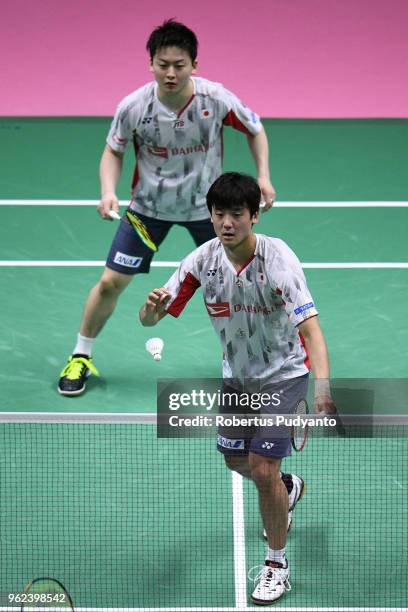 Takuto Inoue and Yuki Kaneko of Japan compete against Kim Astrup and Anders Skaarup Rasmussen of Denmark during the Semi-finals match on day six of...