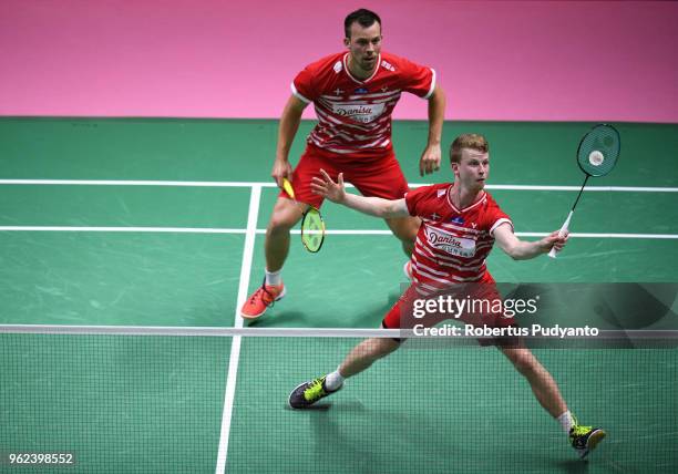 Kim Astrup and Anders Skaarup Rasmussen of Denmark compete against Takuto Inoue and Yuki Kaneko of Japan during the Semi-finals match on day six of...