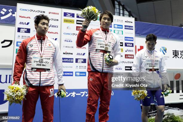 Winner Katsuhiro Matsumoto of Japan celebrates with runner-up Kosuke Hagino of Japan and third-placed Yuki Kobori of Japan after the Men's 200m...