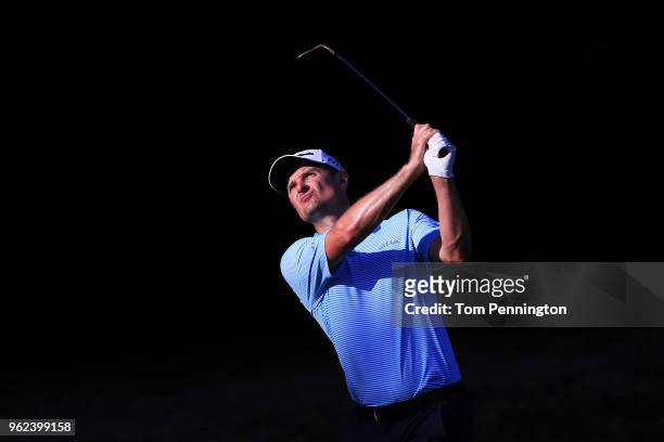 Justin Rose of England plays his shot on the 11th hole during round two of the Fort Worth Invitational at Colonial Country Club on May 25, 2018 in...