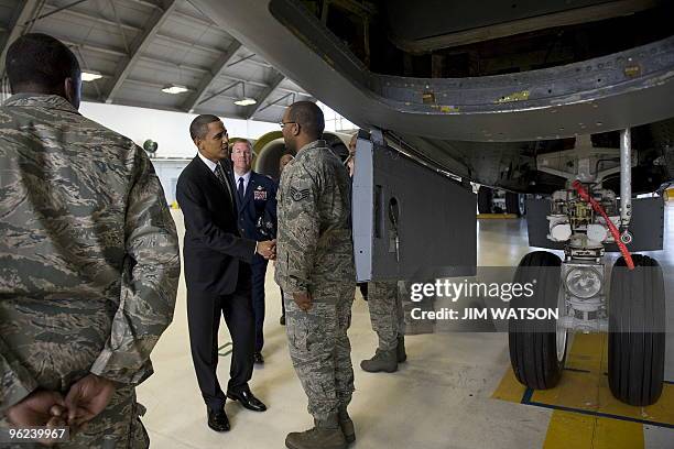 President Barack Obama greets members of the US Air Force as he tours a maintenance hangar for a KC-135 Stratotanker as he arrives at MacDill Air...