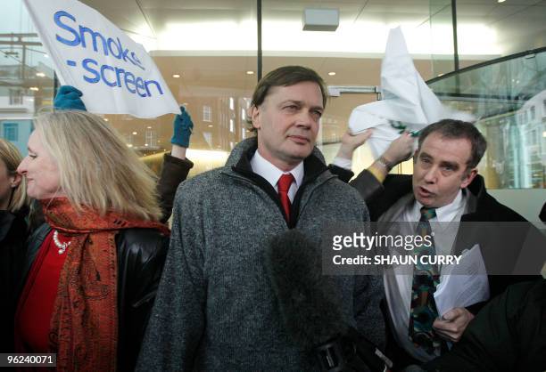 British investigative reporter Brian Deer confronts British Doctor Andrew Wakefield as he arrives with his wife Carmel at the General Medical Council...
