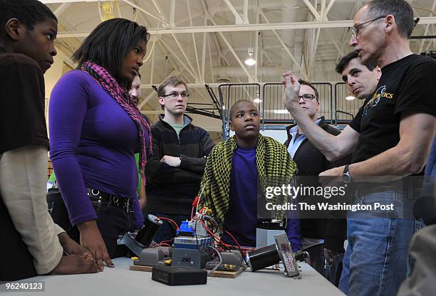 From left to right, Ronovan Johnson, Diana Webster, Kris Comeforo - teacher, Tevin Johnson, Michael Nagao, and Jordan Snyder listen to robotics...