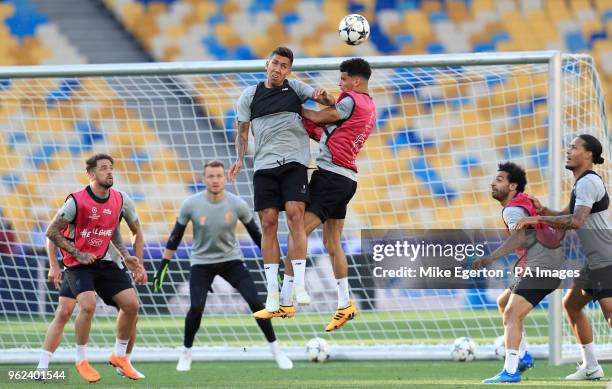 Liverpool's Roberto Firmino and Dominic Solanke battle for the ball during the training session at the NSK Olimpiyskiy Stadium, Kiev.