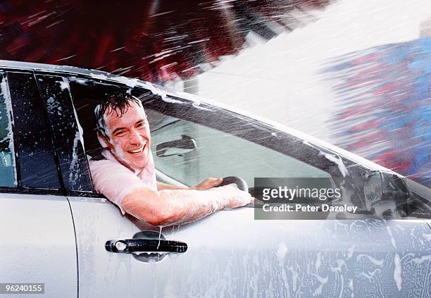 man caught out in car wash with window open. - car wash stockfoto's en -beelden