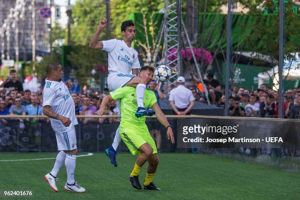 Yevgen Levchenko of Andriy Shevchenko and Friends is fouled by Alvaro Arbeloa of Real Madrid CF in the Ultimate Champions Tournament prior to the...