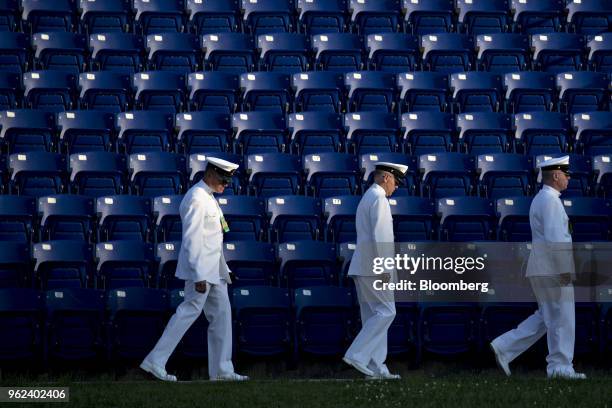 Midshipmen arrive before the start of the United States Naval Academy graduation and commissioning ceremony at the Navy-Marine Corps Memorial Stadium...
