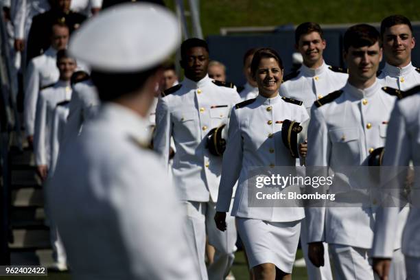 Graduating midshipmen arrive during the United States Naval Academy graduation and commissioning ceremony at the Navy-Marine Corps Memorial Stadium...