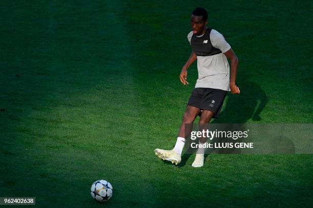 Liverpool's English midfielder Alex Oxlade-Chamberlain kicks the ball during a Liverpool team training session at the Olympic Stadium in Kiev,...