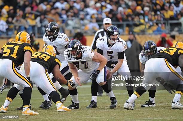 Quarterback Joe Flacco of the Baltimore Ravens takes the football from center Matt Birk during a game against the Pittsburgh Steelers at Heinz Field...