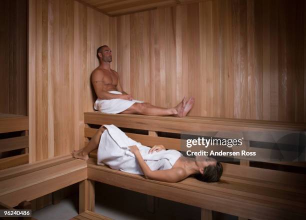 man and woman in sauna at spa - day spa stock pictures, royalty-free photos & images