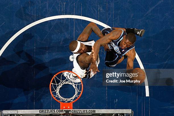 Ronnie Brewer of the Utah Jazz goes to the basket over Zach Randolph of the Memphis Grizzlies during the game on January 8, 2010 at FedExForum in...