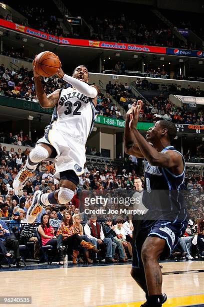 Mayo of the Memphis Grizzlies goes up for a shot over Ronnie Brewer of the Utah Jazz during the game on January 8, 2010 at FedExForum in Memphis,...
