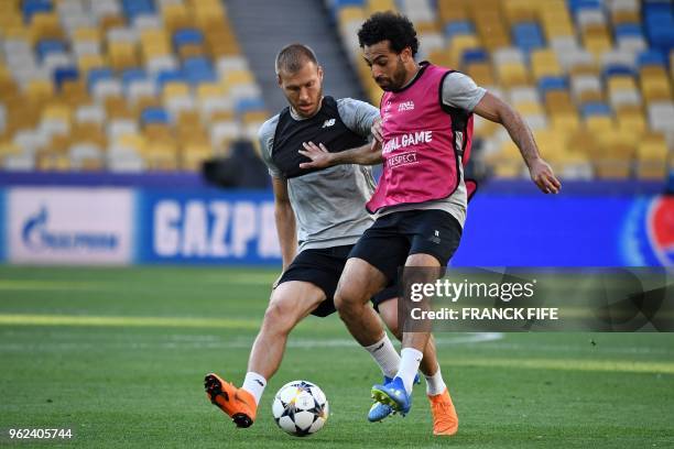 Liverpool's Egyptian forward Mohamed Salah and Liverpool's Estonian defender Ragnar Klavan take part in a Liverpool team training session at the...