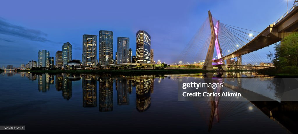 Sao Paulo skyline reflected on Pinheiros River at blue hour