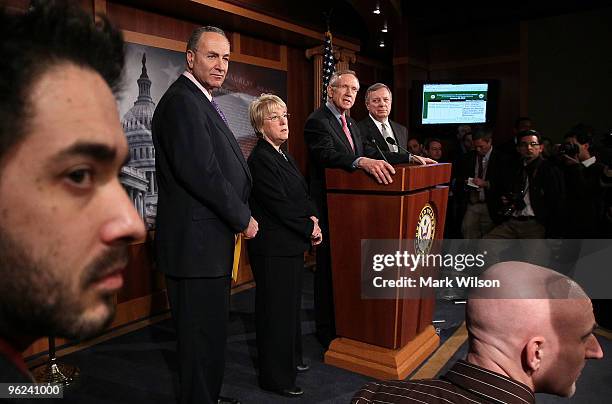 Senate Majority Leader Harry Reid speaks during a news conference as Sen. Richard Durbin , Sen. Patty Murray and Sen. Charles Schumer listen on...