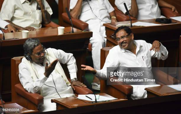 Deputy Chief Minister of Karnataka G Parameshwara and former Chief Minister Siddaramaiah shares a light moment during a special session to prove the...