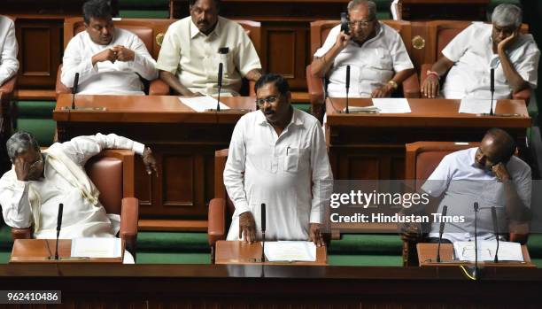 Deputy Chief Minister Dr G Parameshwara speaks as Chief Minister of Karnataka Kumarswamy and former Chief Minister Siddaramaiah look on during a...