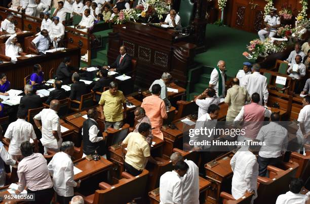 Karnataka President and legislative Party leader BS Yeddyurappa along with his MLAs walks out of the Karnataka Assembly at Vidhana Soudha on May 25,...