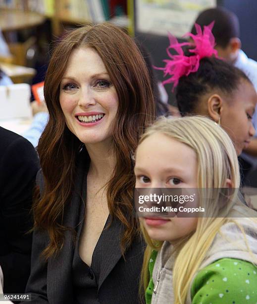 Actress Julianne Moore poses with a the Save The Children Valentine's Day Contest Winners Lunch at The Harriet Tubman School, C.S. 154 on January 28,...
