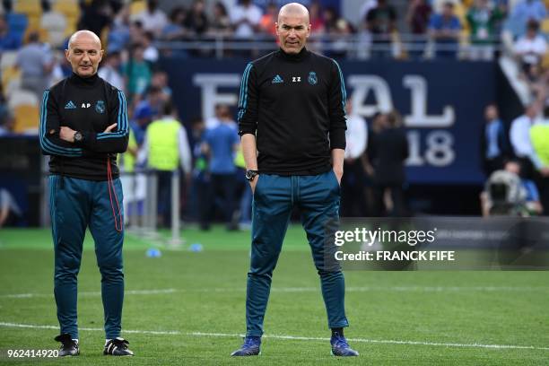 Real Madrid's French coach Zinedine Zidane and fitness coach Antonio Pintus attend a Real Madrid team training session at the Olympic Stadium in...