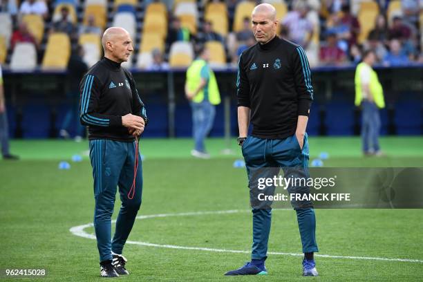 Real Madrid's French coach Zinedine Zidane and fitness coach Antonio Pintus attend a Real Madrid team training session at the Olympic Stadium in...