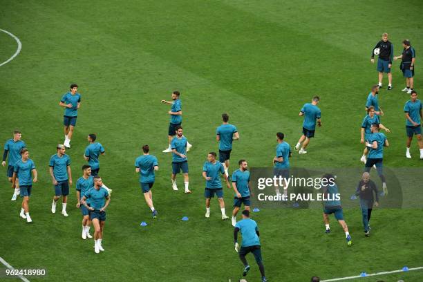 Real Madrid fitness coach Antonio Pintus leads the players in a team training session at the Olympic Stadium in Kiev, Ukraine on May 25 on the eve of...