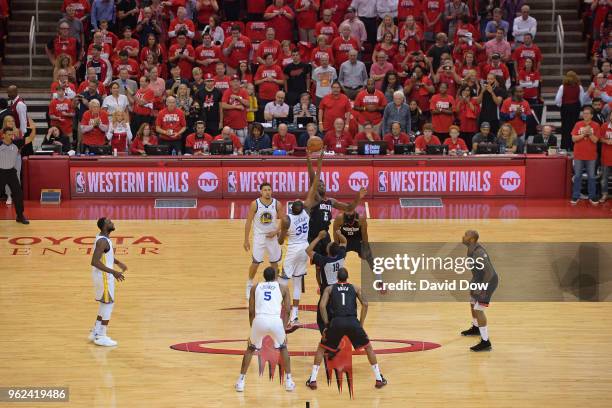 Clint Capela of the Houston Rockets and Kevin Durant of the Golden State Warriors tip-off at the start of Game Five of the Western Conference Finals...