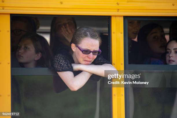 Evacuated middle school students wait on a bus outside Noblesville High School after a shooting at Noblesville West Middle School on May 25, 2018 in...