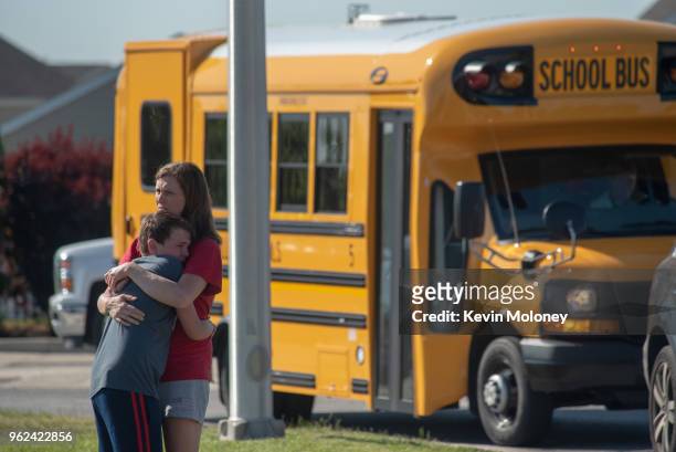 Student and adult embrace outside Noblesville West Middle School after a shooting at the school on May 25, 2018 in Noblesville, Indiana. One teacher...