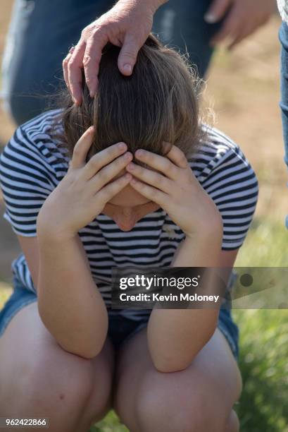 Staff and students comfort each other outside Noblesville West Middle School after a shooting at the school on May 25, 2018 in Noblesville, Indiana....