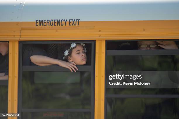 Evacuated middle school students wait on a bus outside Noblesville High School after a shooting at Noblesville West Middle School on May 25, 2018 in...