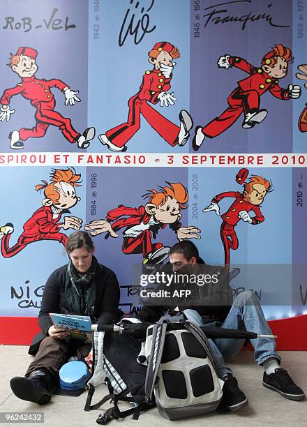 People read comic books on January 28, 2010 in Angouleme, western France, on the opening of the 37th edition of the International comic books...
