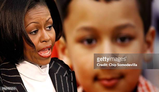 First lady Michelle Obama speaks about the government and community efforts to fight childhood obesity while visiting the YMCA January 28, 2010 in...