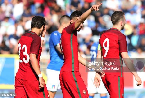 Portugal and SL Benfica forward Diogo Goncalves celebrates with teammates after scoring a goal during the U21 International Friendly match between...
