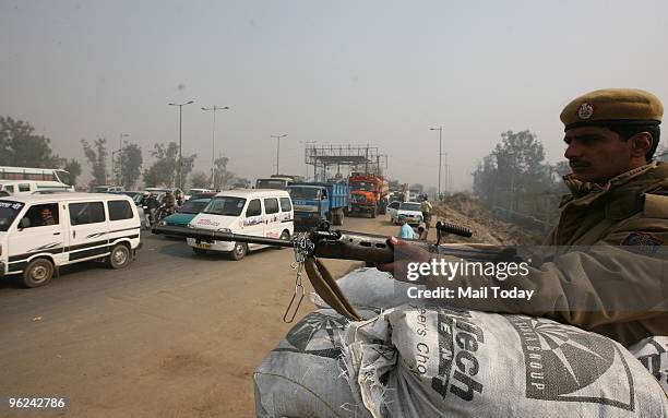 Delhi Police Jawans in Alert Procession at Ghazipur Border during the 'Full Dress Rehearsal' for the Republic Day parade, in New Delhi on Saturday...