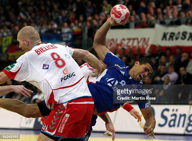 Karol Bielecki of Poland in action with Daniel Narcisse of France during the Men's Handball European main round Group II match between Poland and...
