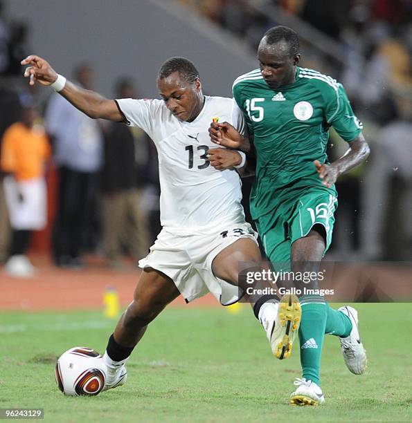 Dede Ayew of Ghana and Sani Kaita of Nigeria compete during the Africa Cup of Nations semi final match between Ghana and Nigeria from the November 11...