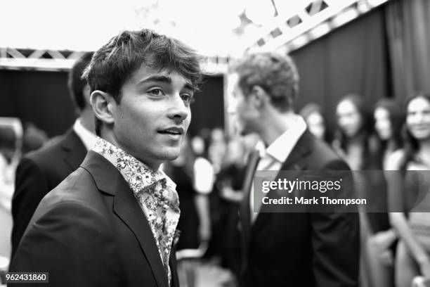 Charles Leclerc of Monaco and Sauber F1 prepares backstage at the Amber Lounge Fashion show during previews ahead of the Monaco Formula One Grand...